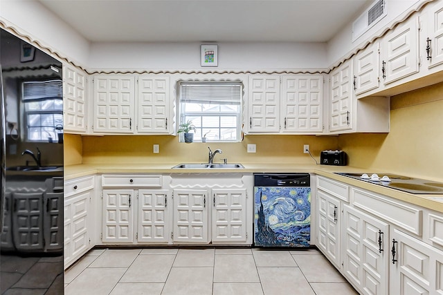 kitchen featuring black appliances, a sink, white cabinets, light countertops, and light tile patterned floors