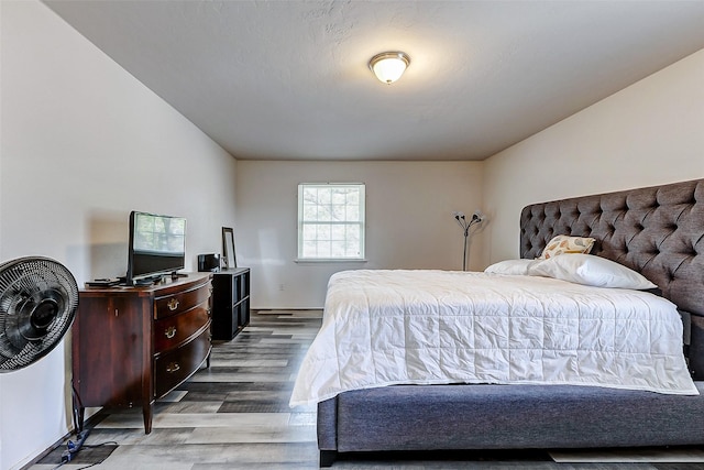 bedroom featuring wood finished floors