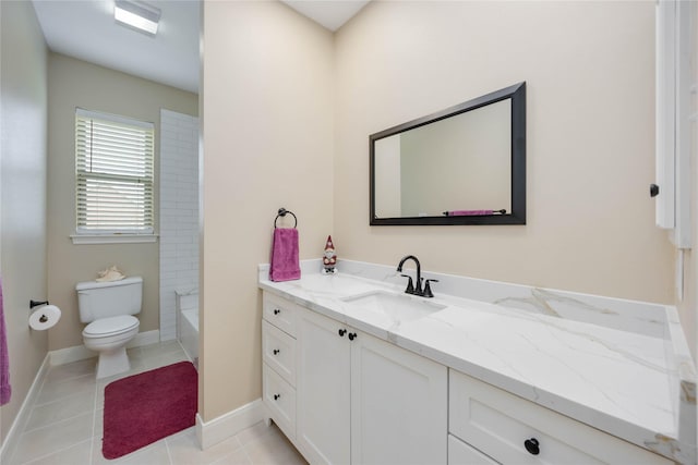 full bath featuring tile patterned flooring, toilet, vanity, and baseboards