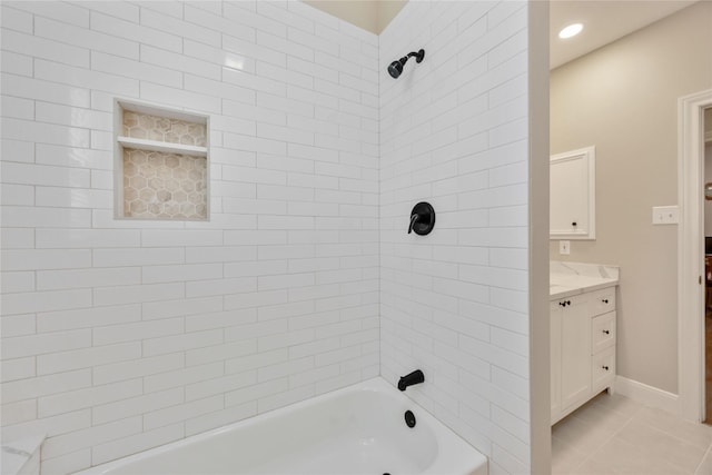 bathroom with vanity, tile patterned floors, tub / shower combination, and baseboards