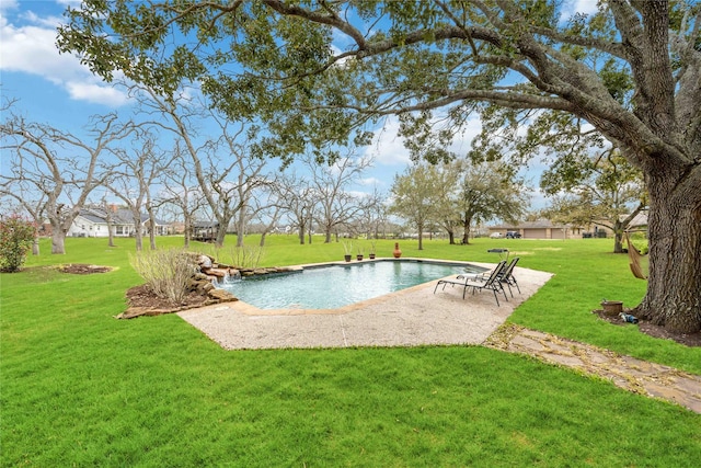 view of pool with a lawn