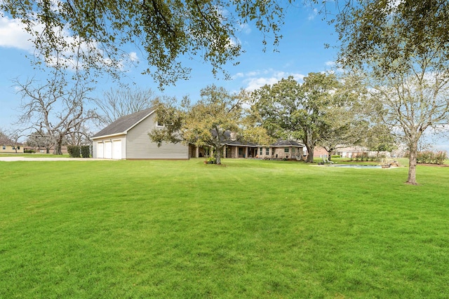 view of yard with a garage