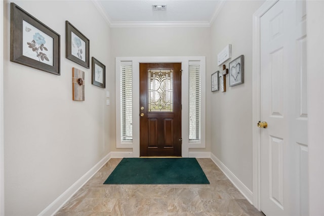 foyer featuring visible vents, baseboards, and ornamental molding