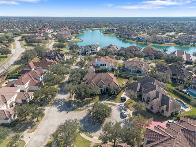 birds eye view of property featuring a residential view and a water view