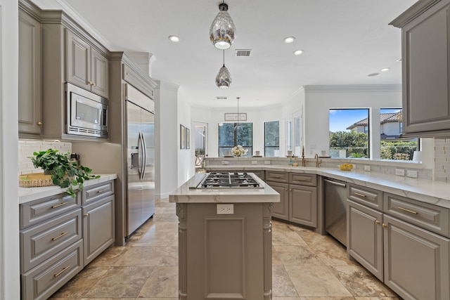 kitchen with built in appliances, gray cabinetry, crown molding, and visible vents