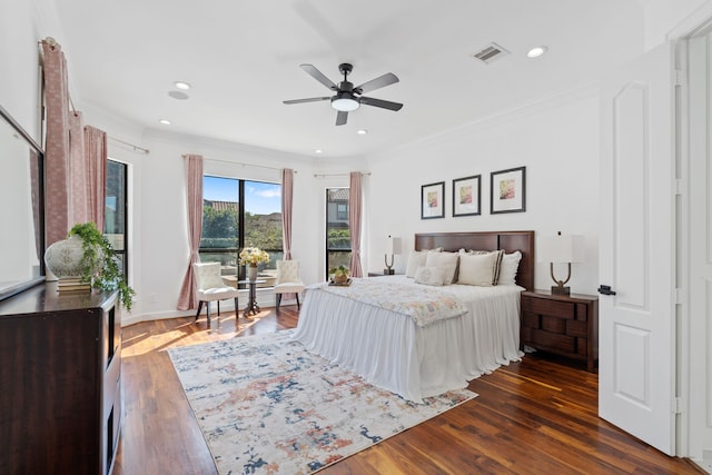 bedroom with dark wood-style floors, visible vents, recessed lighting, crown molding, and access to outside