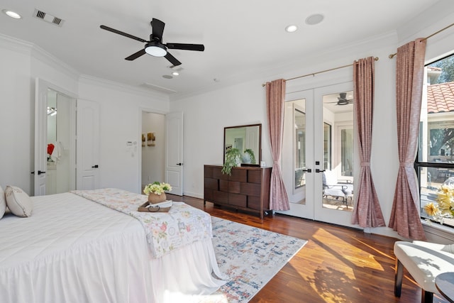 bedroom with visible vents, ornamental molding, recessed lighting, french doors, and wood finished floors