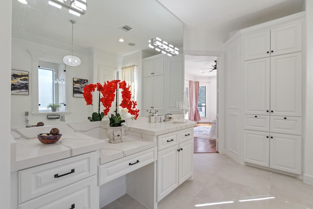 bathroom with visible vents, a ceiling fan, vanity, and tile patterned flooring