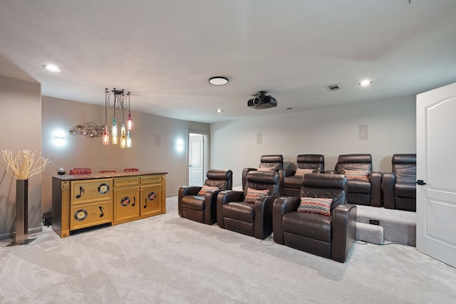 home theater room with recessed lighting, visible vents, and light carpet