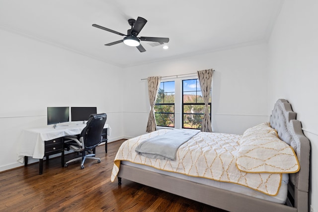 bedroom featuring a ceiling fan, wood finished floors, and baseboards