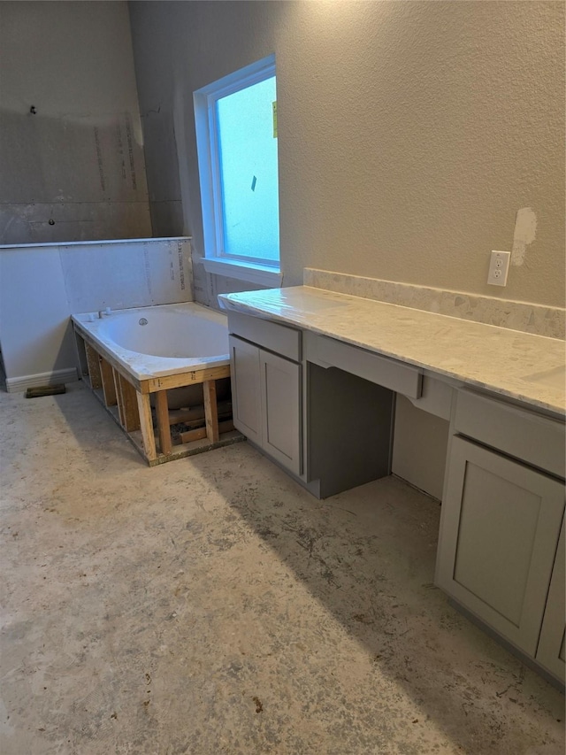 bathroom featuring a garden tub