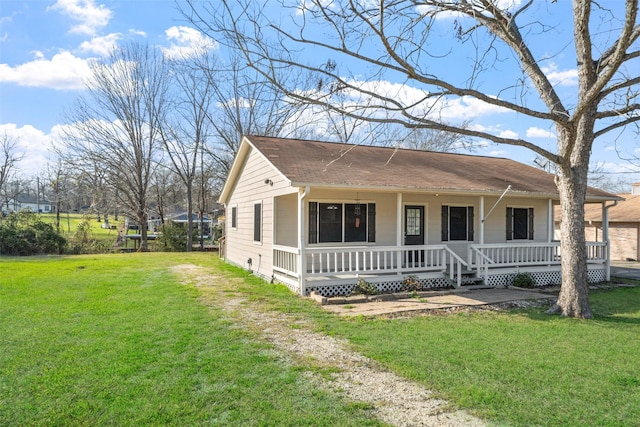 view of front of house featuring covered porch, driveway, and a front lawn