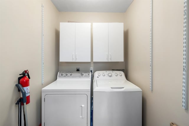 laundry area featuring cabinet space and washer and dryer