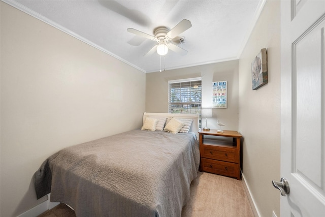 bedroom featuring light carpet, baseboards, a ceiling fan, and crown molding