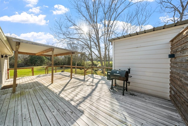 wooden deck with a grill