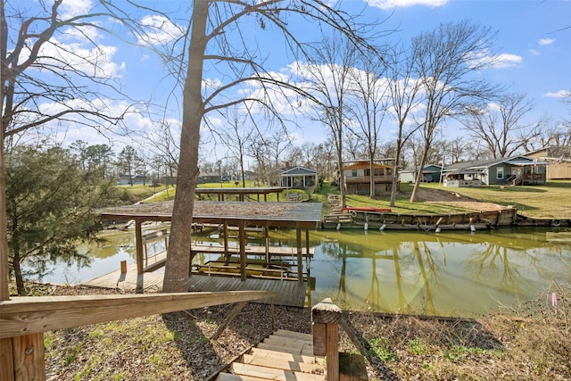 dock area featuring a water view and a residential view