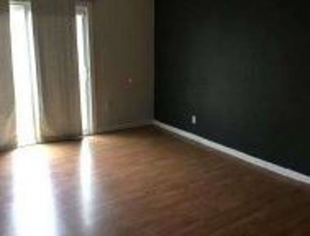 spare room featuring baseboards