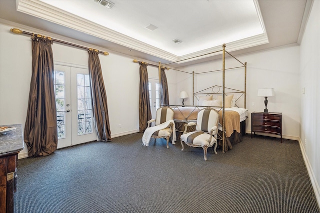 bedroom featuring access to outside, ornamental molding, a tray ceiling, and french doors