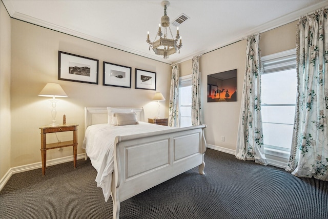 bedroom featuring dark carpet, visible vents, a notable chandelier, and baseboards