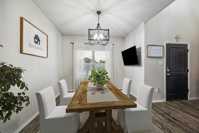 dining room with an inviting chandelier, baseboards, and dark wood finished floors