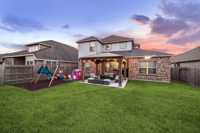 back of house with a playground, brick siding, outdoor lounge area, a patio area, and a fenced backyard