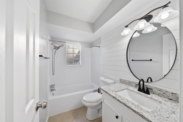 bathroom featuring toilet, washtub / shower combination, wood walls, vanity, and tile patterned flooring