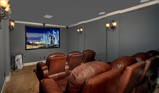 carpeted cinema with baseboards, visible vents, and crown molding