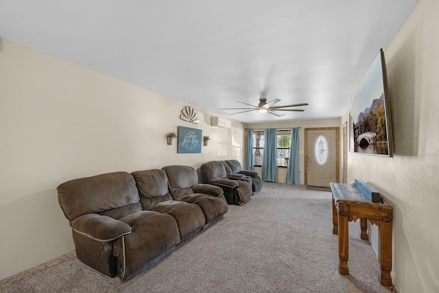 living room featuring light colored carpet and ceiling fan