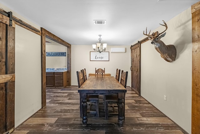 dining space featuring a barn door, a chandelier, dark wood finished floors, and a wall unit AC