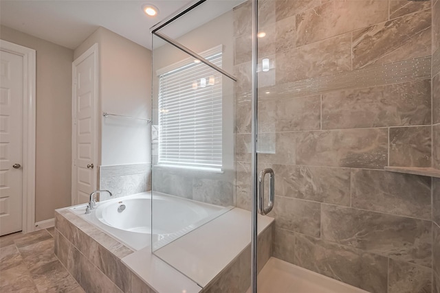 bathroom featuring a stall shower, a garden tub, and recessed lighting