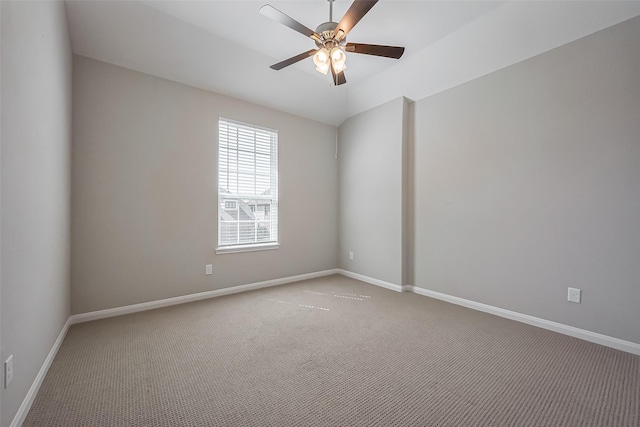 unfurnished room with carpet floors, baseboards, and a ceiling fan