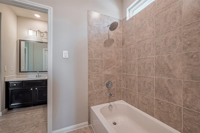 bathroom with shower / bath combination, baseboards, and vanity