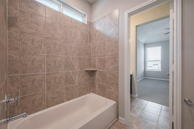 full bath featuring shower / bathtub combination, baseboards, and tile patterned floors