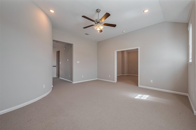 spare room with vaulted ceiling, recessed lighting, a ceiling fan, and baseboards