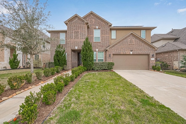 traditional home featuring concrete driveway, a garage, brick siding, and a front yard