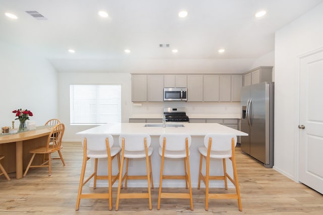 kitchen featuring a sink, visible vents, appliances with stainless steel finishes, and gray cabinets