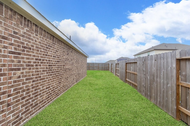 view of yard featuring a fenced backyard