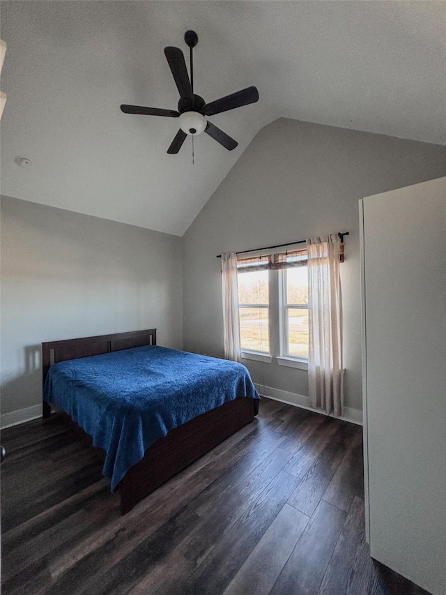 bedroom featuring ceiling fan, baseboards, vaulted ceiling, and dark wood-type flooring