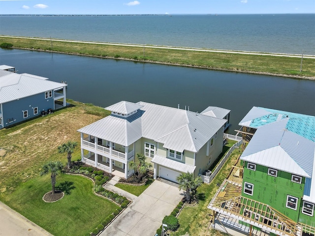 birds eye view of property with a water view