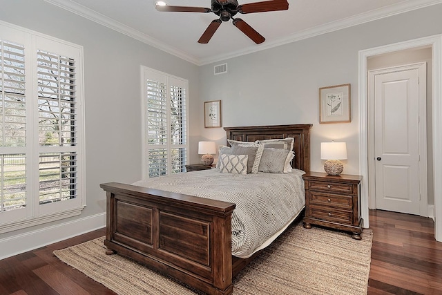 bedroom with visible vents, crown molding, a ceiling fan, and wood finished floors