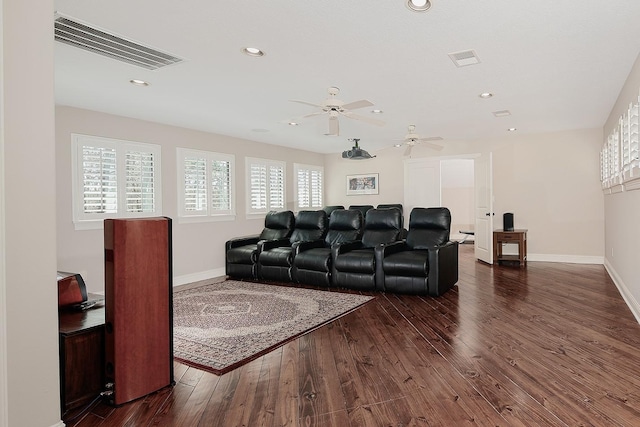 living room with dark wood-style floors, visible vents, and baseboards