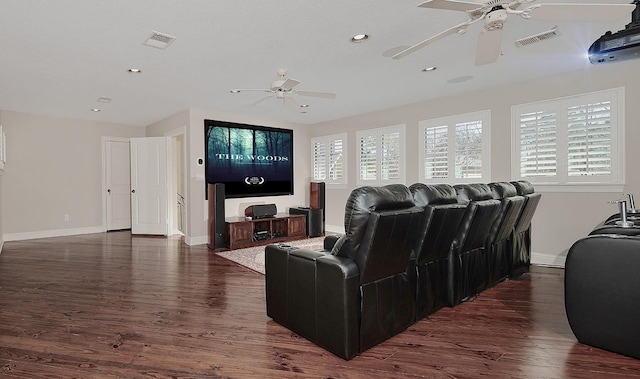 living room featuring dark wood finished floors, plenty of natural light, and visible vents