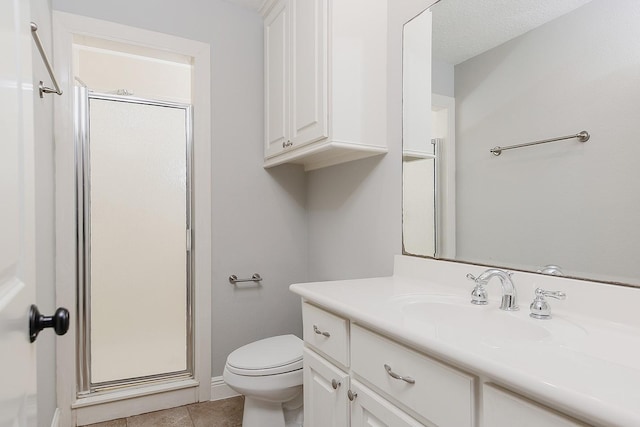 full bath featuring tile patterned flooring, a shower stall, toilet, and vanity