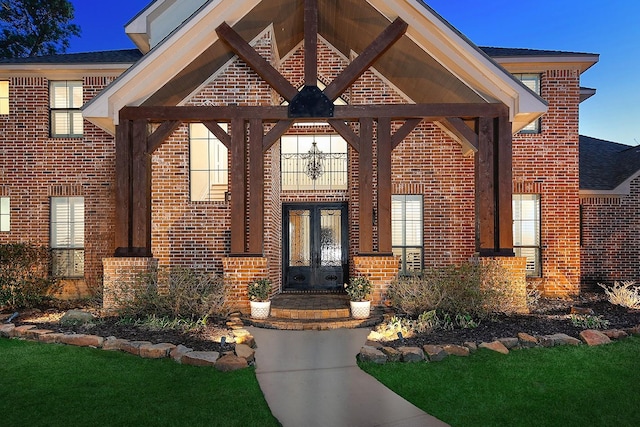 entrance to property with brick siding