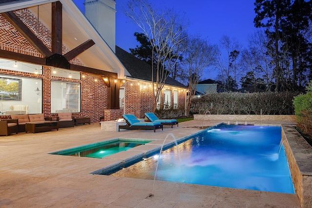 pool at twilight featuring outdoor lounge area, a patio, an outdoor pool, and an in ground hot tub