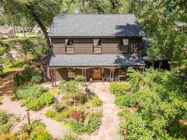 view of front of house featuring roof with shingles