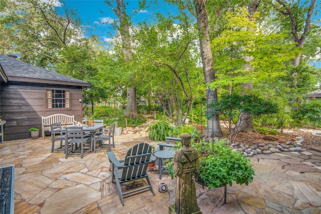 view of patio featuring outdoor dining area