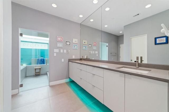 full bath with double vanity, visible vents, tile patterned flooring, a sink, and recessed lighting