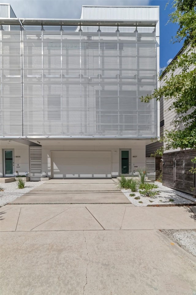1807 Prospect St, Houston, TX 77004 - view of building exterior featuring an attached garage and driveway