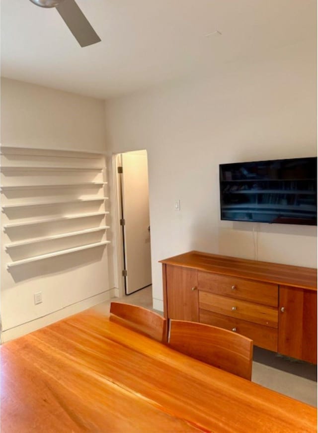 unfurnished bedroom featuring light wood finished floors and a ceiling fan